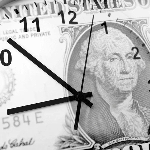 Image of clock on money