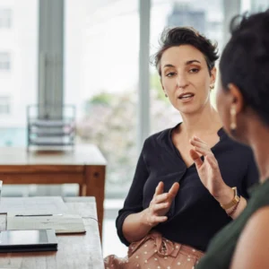 Two individuals meeting for a discussion.