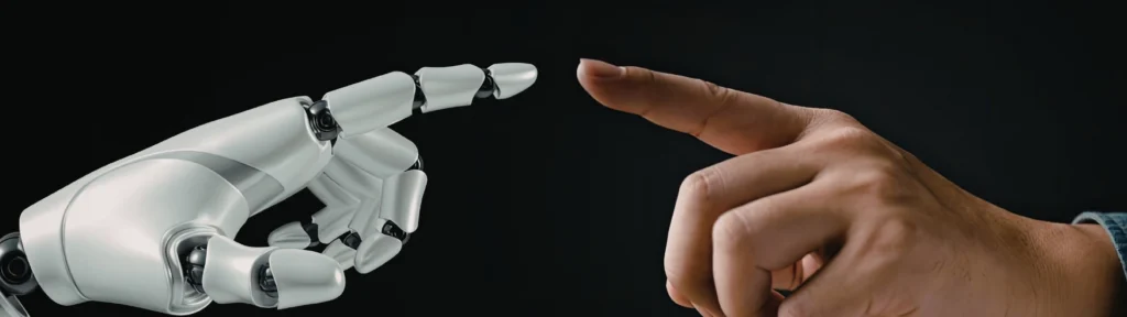 Image of a robot finger and human finger showing the connection between AI and Humans